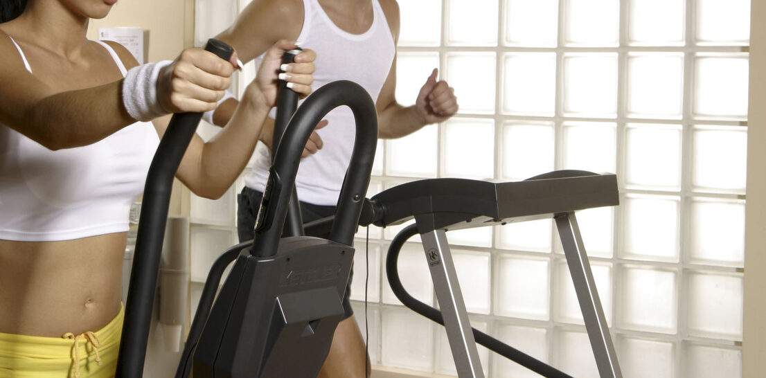 Woman on Elliptical, Man on Treadmill
