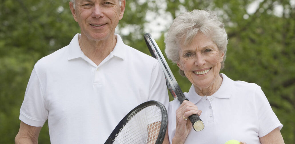 Retired Couple playing Tennis
