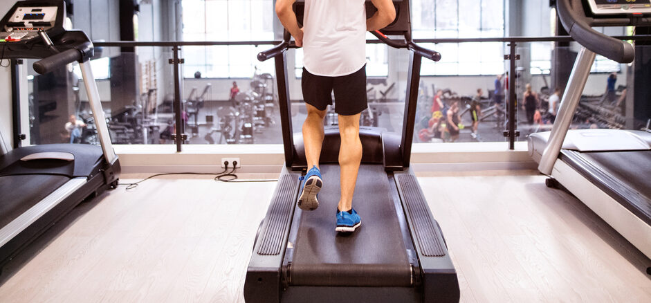 Man walking on Treadmill in Health Club